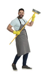 Young man with yellow broom on white background