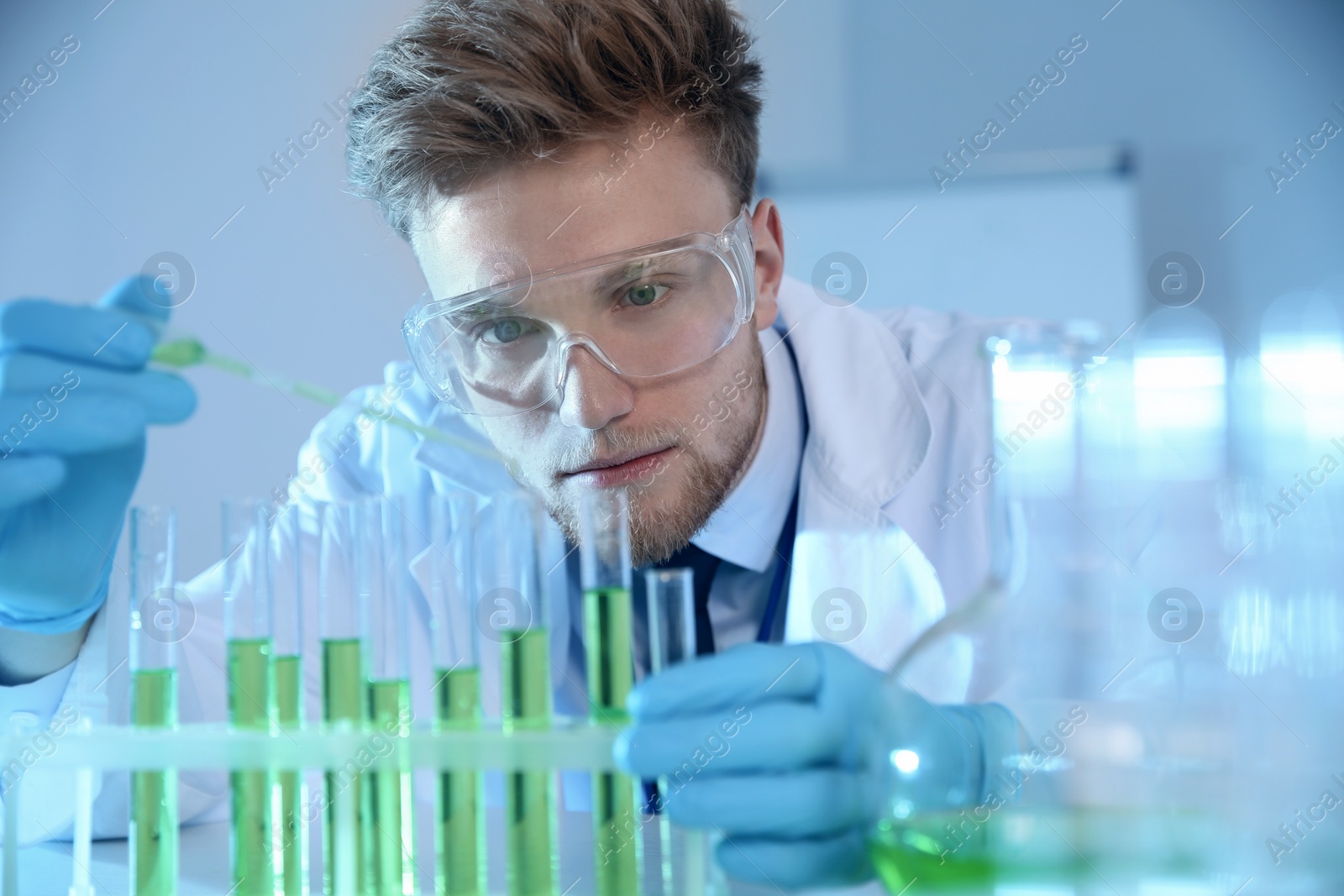 Photo of Male scientist working with sample in chemistry laboratory