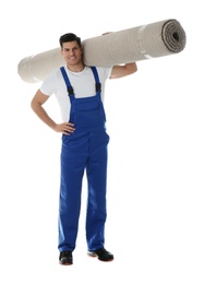 Photo of Male worker with rolled carpet on white background