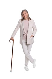 Senior woman with walking cane on white background