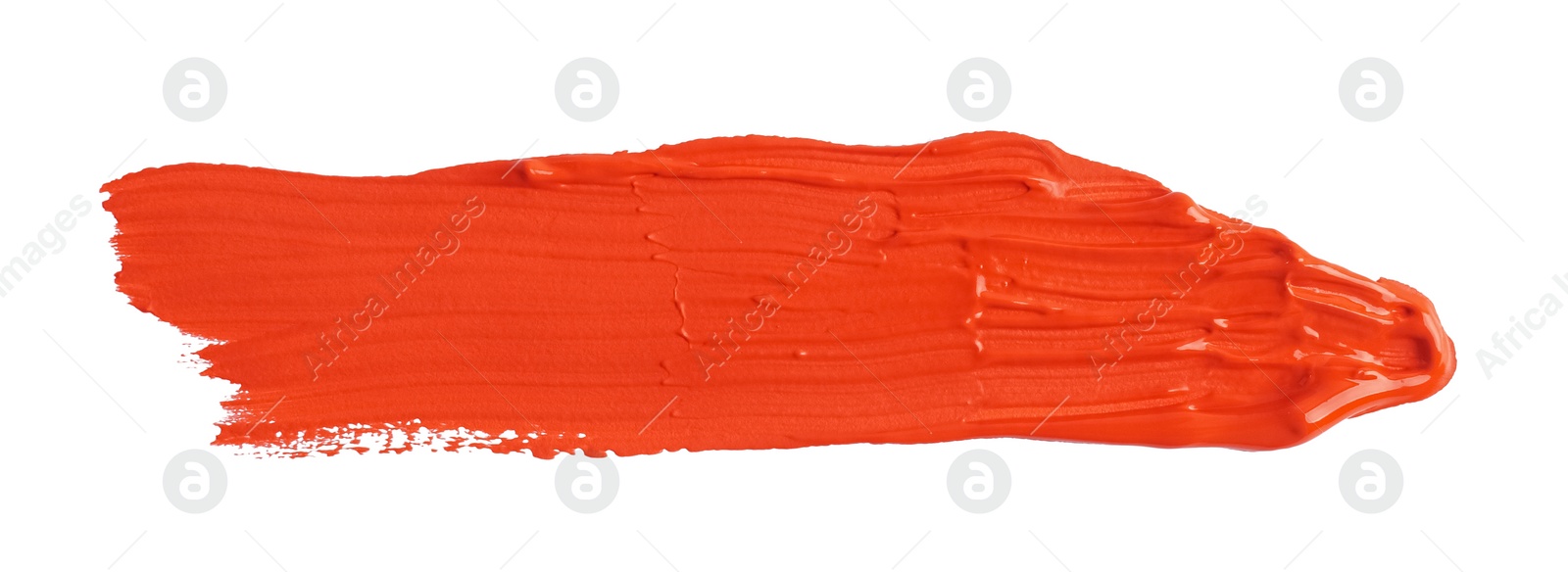 Photo of Red paint stroke drawn with brush on white background, top view