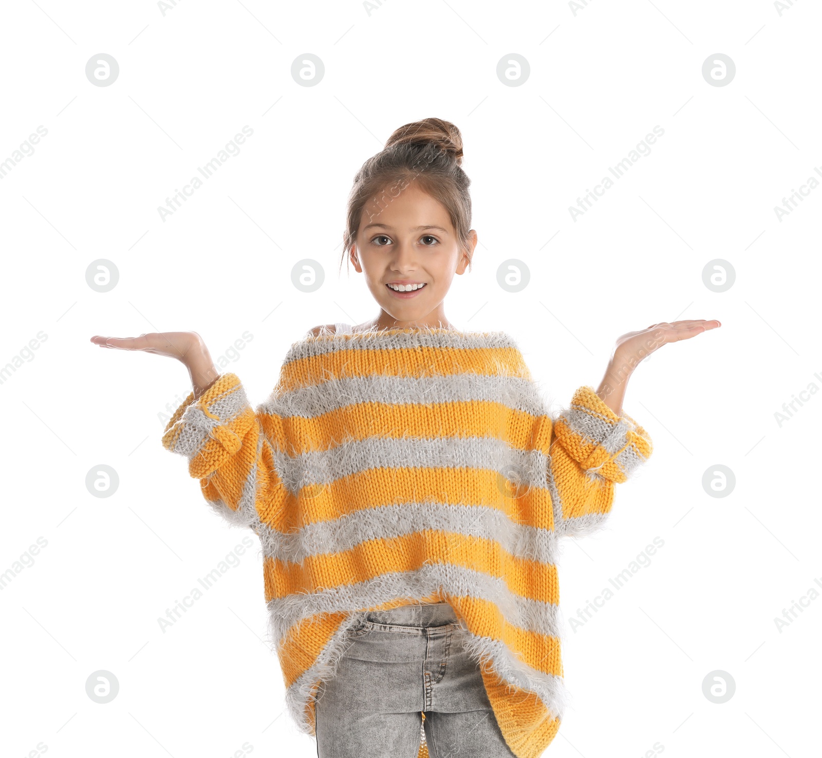 Photo of Pretty emotional preteen girl posing against white background
