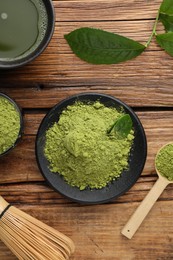 Flat lay composition with green matcha powder on wooden table