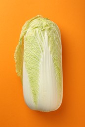 Photo of Fresh ripe Chinese cabbage on orange background, top view