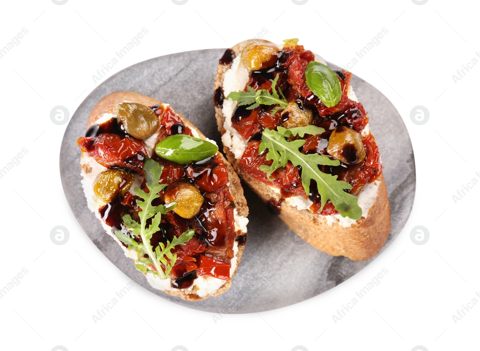 Photo of Delicious bruschettas with balsamic vinegar and toppings isolated on white, top view