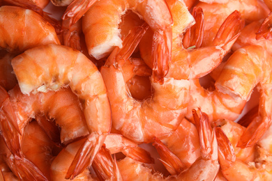 Photo of Pile of delicious cooked shrimps as background, closeup