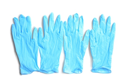 Photo of Medical gloves on white background, top view