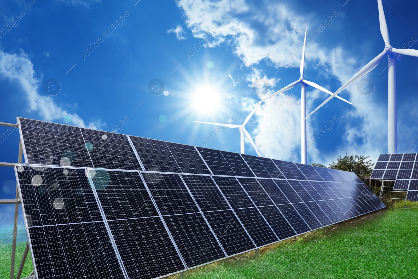 Image of Solar panels and wind turbines installed outdoors. Alternative energy source