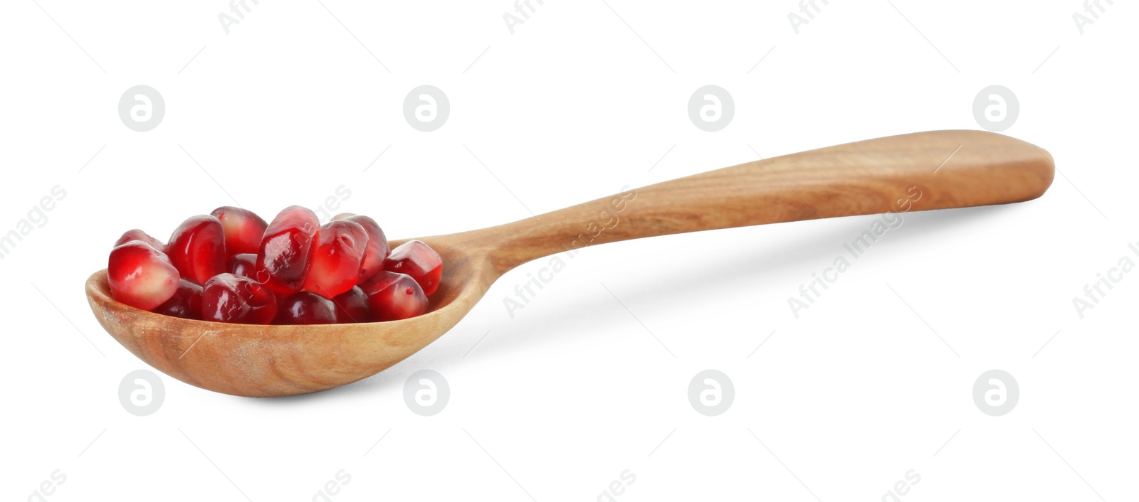 Photo of Ripe juicy pomegranate grains in wooden spoon isolated on white