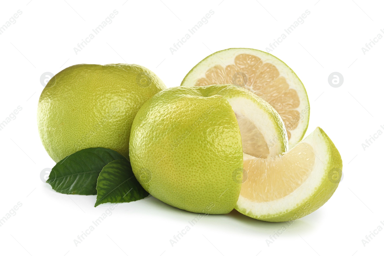 Photo of Whole and cut sweetie fruits with green leaves on white background