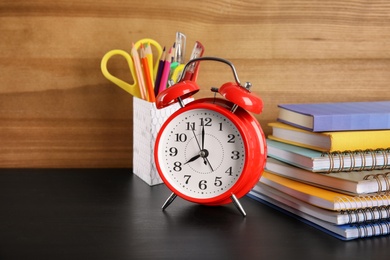 Photo of Different stationery on wooden table. Back to school