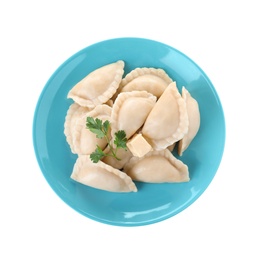 Plate of tasty dumplings served with parsley and butter on white background, top view