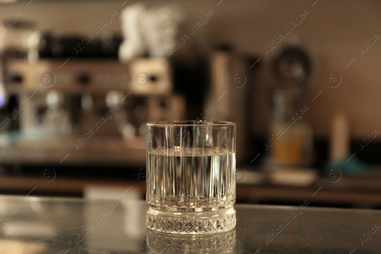 Photo of Glass with water on countertop in cafe