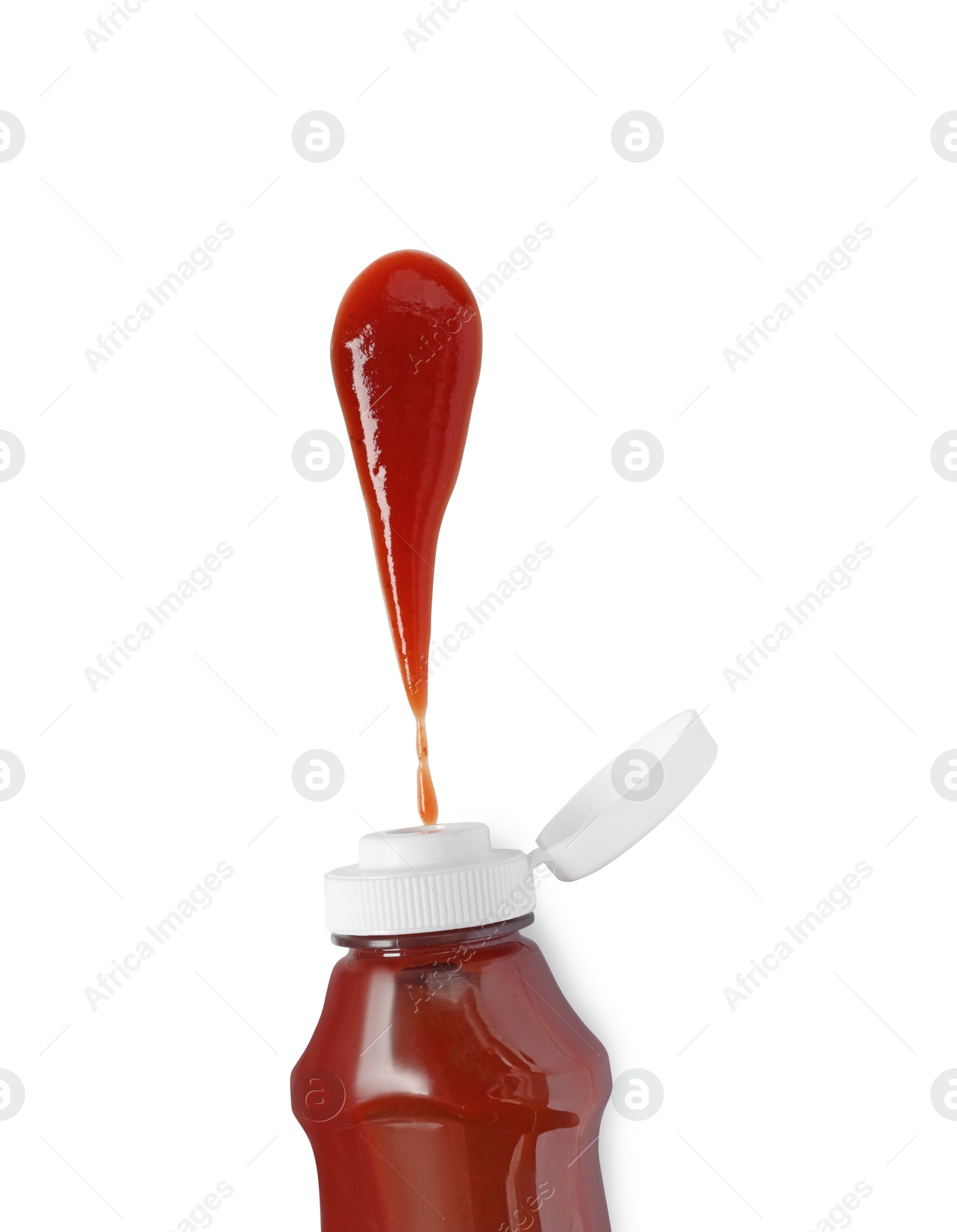 Photo of Squeezed ketchup from bottle isolated on white, top view