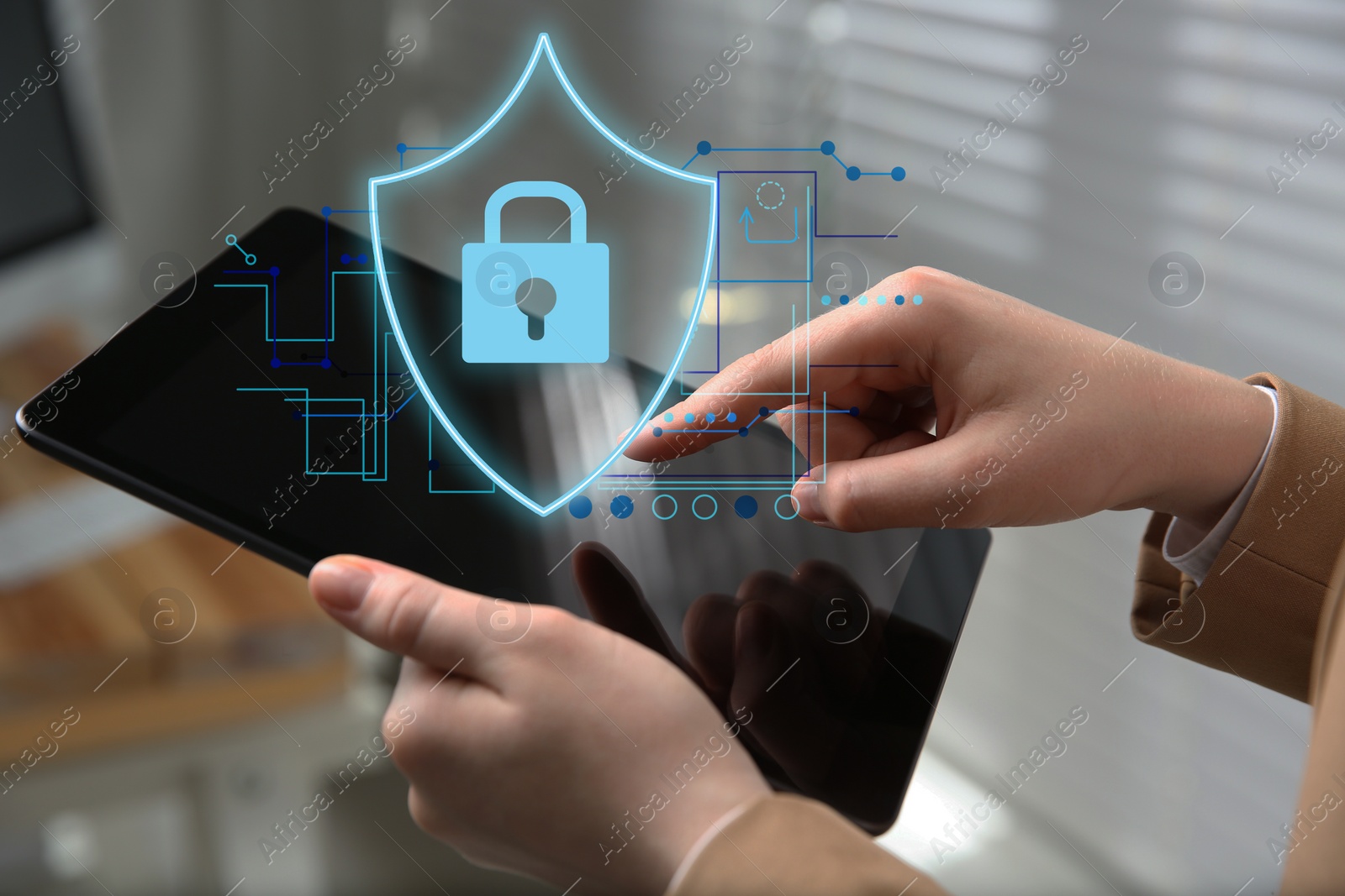 Image of Privacy protection. Woman using tablet in office, closeup. Digital scheme with illustration of padlock in shield over device