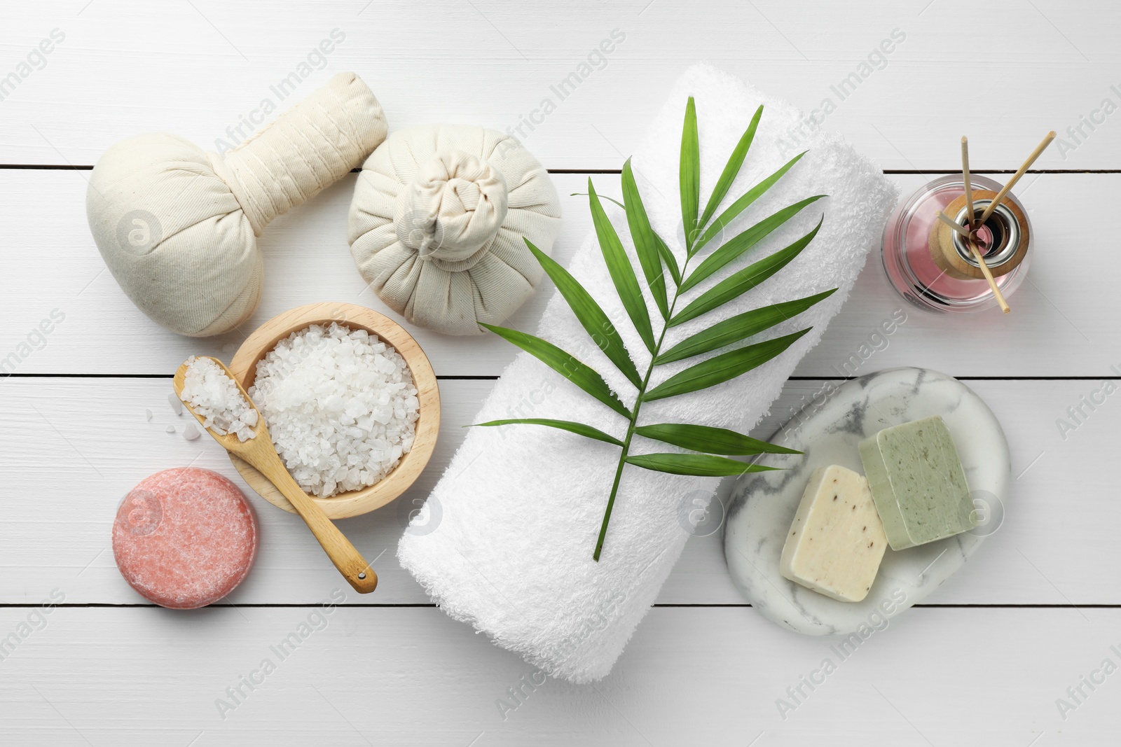 Photo of Flat lay composition with different spa products on white wooden table