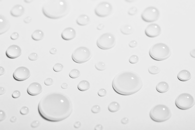 Pure water drops on white background, closeup