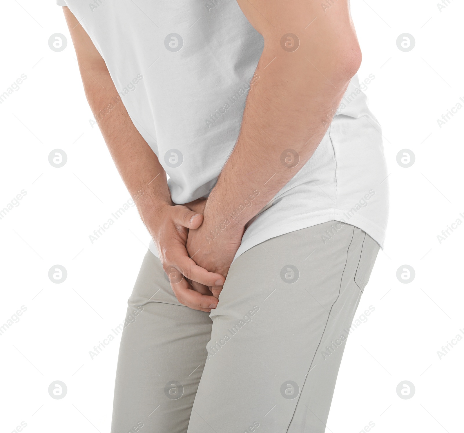 Photo of Young man with urological problems suffering from pain on white background