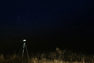Modern telescope and beautiful sky in night outdoors. Learning astronomy