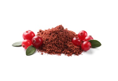 Photo of Dried cranberry powder, fresh berries and green leaves isolated on white