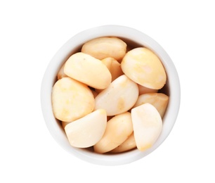 Photo of Bowl with preserved garlic on white background, top view