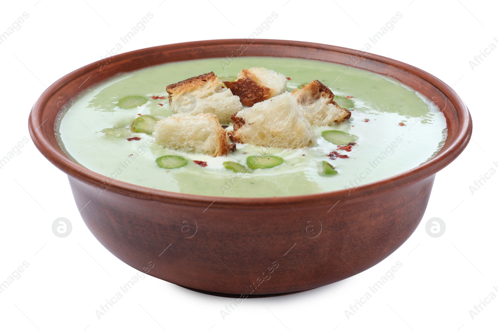 Photo of Delicious asparagus soup with croutons on white background