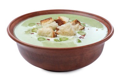 Photo of Delicious asparagus soup with croutons on white background