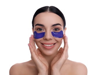 Photo of Beautiful young woman with under eye patches on white background