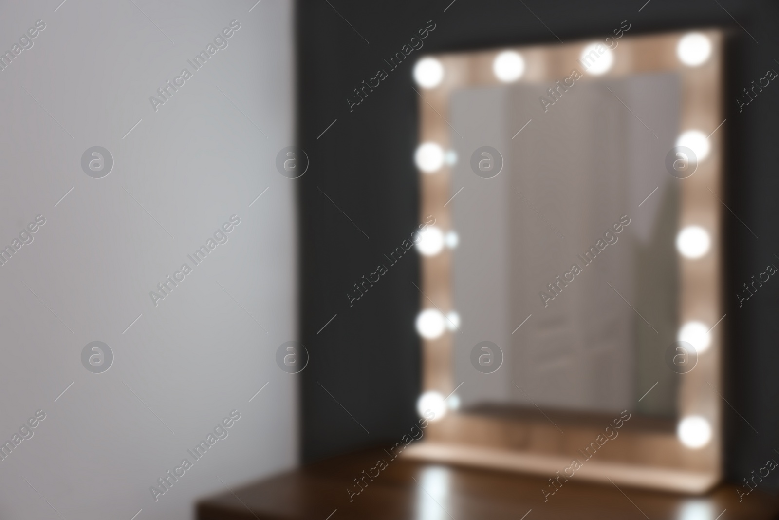 Photo of Beautiful mirror in modern makeup room, blurred view