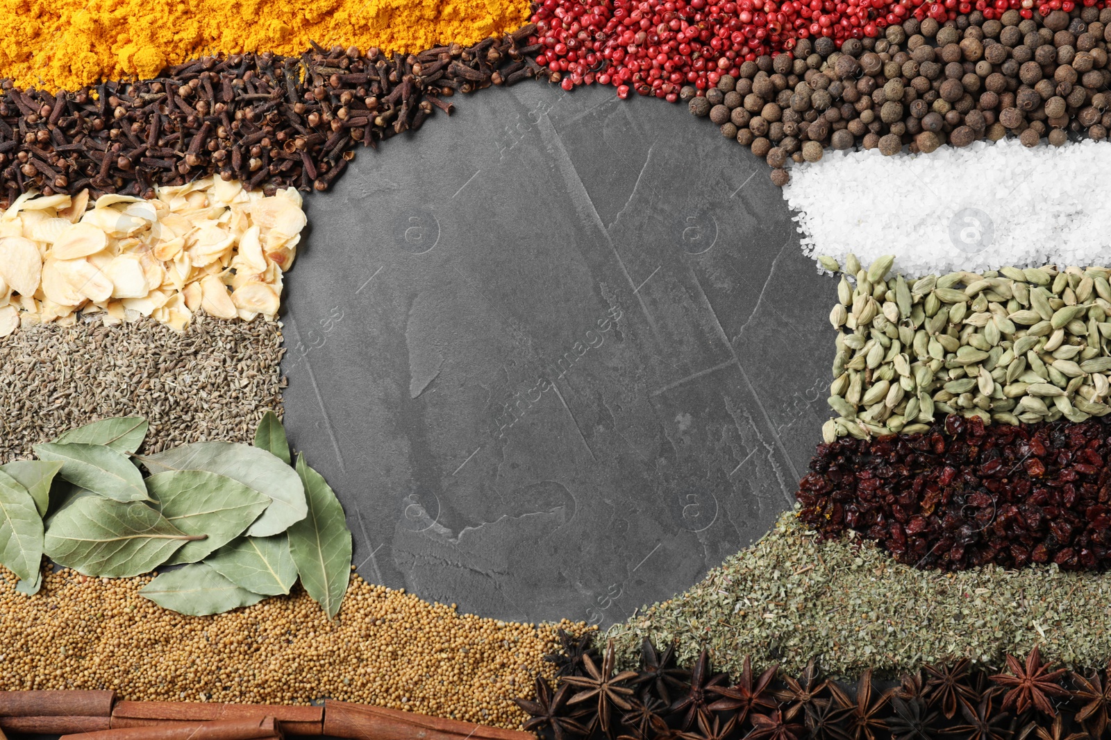 Photo of Frame made with different spices on grey background, flat lay. Space for text