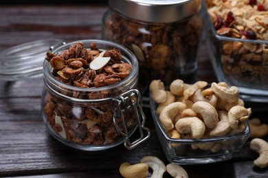 Tasty granola with nuts on wooden table