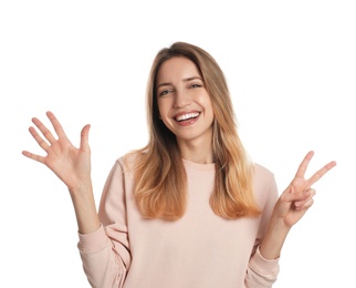 Photo of Woman showing number seven with her hands on white background
