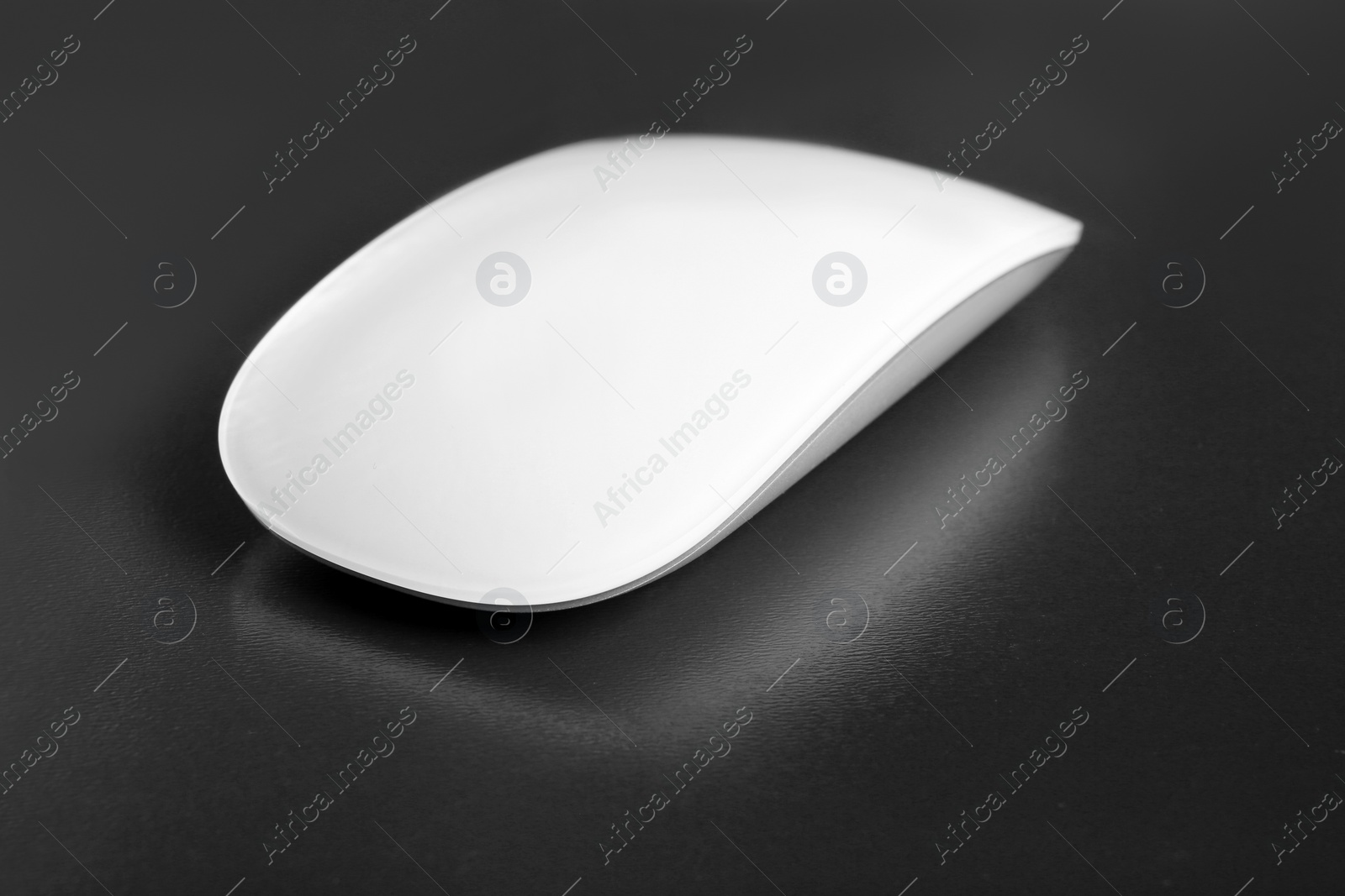 Photo of Wireless computer mouse on grey background