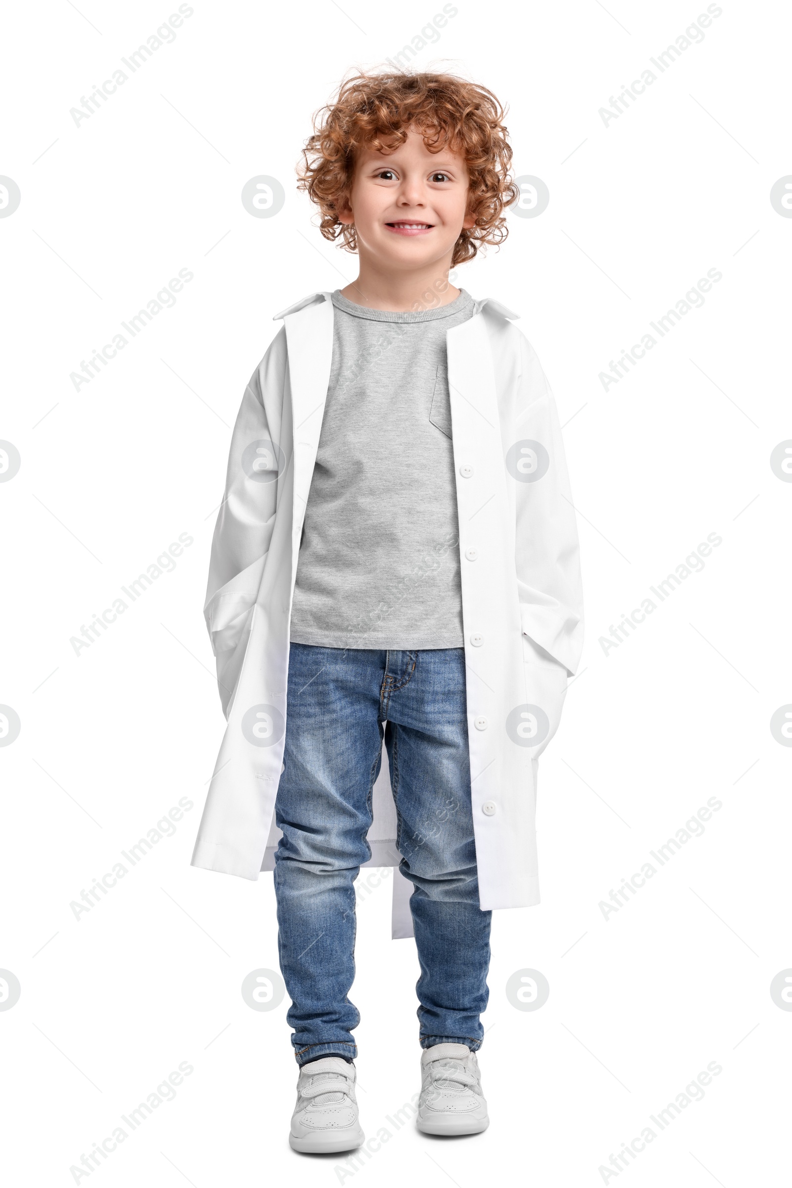 Photo of Full length portrait of little boy in medical uniform on white background