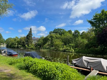 Photo of Beautiful view of canal with moored boats on sunny day