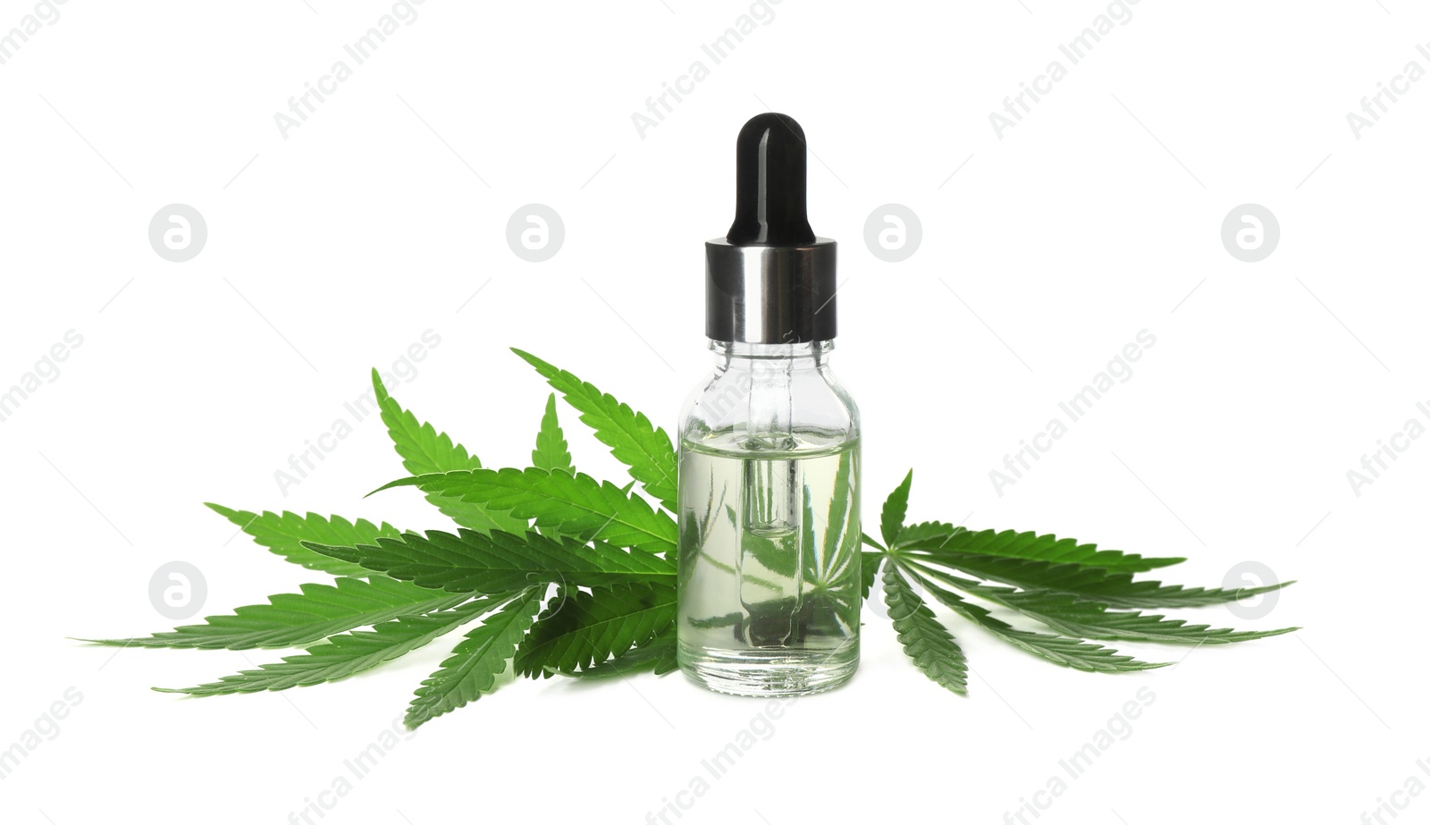 Photo of Bottle of CBD oil or THC tincture and hemp leaves on white background