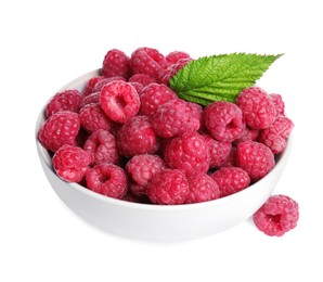 Photo of Bowl of fresh ripe raspberries with green leaf isolated on white
