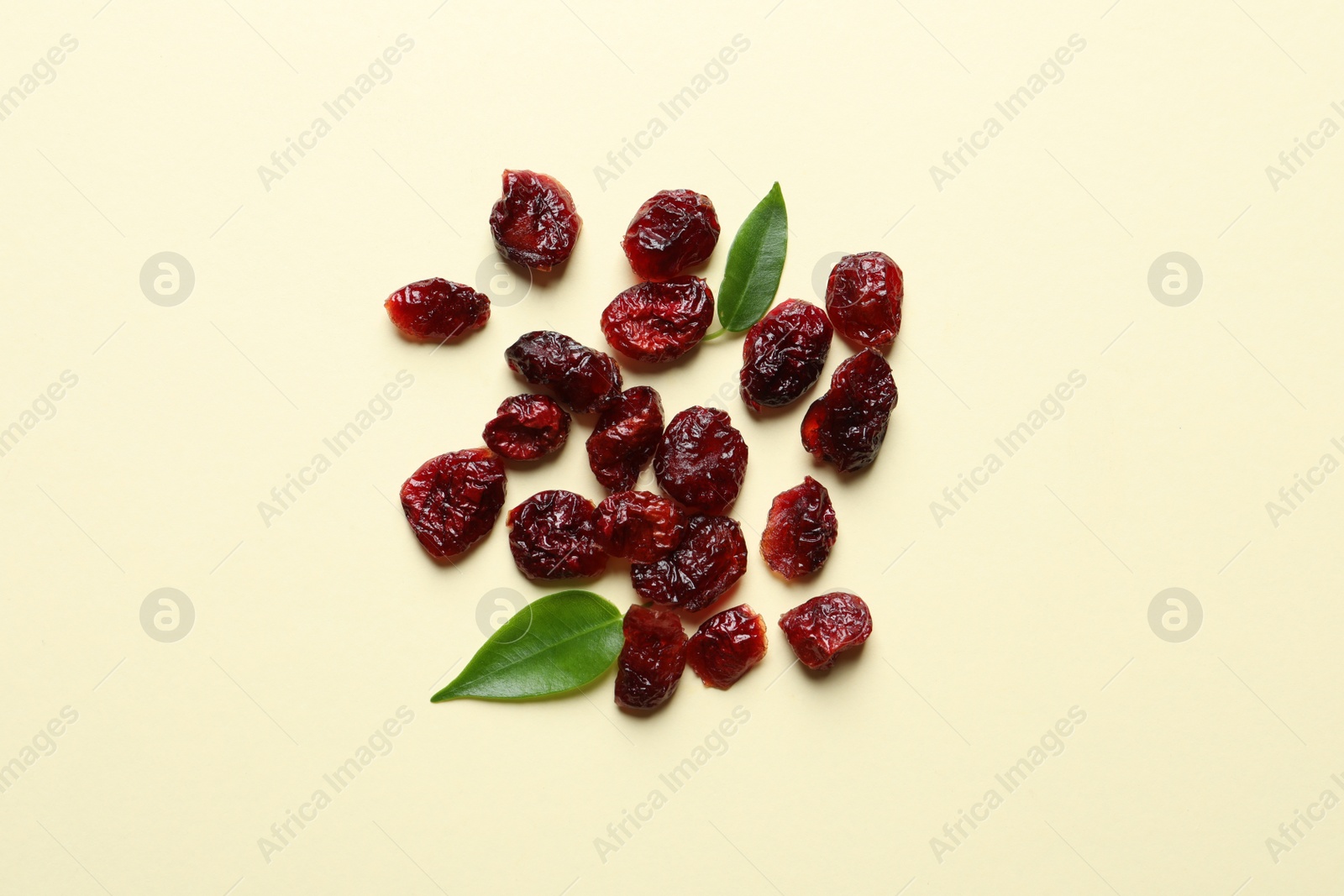 Photo of Cranberries on color background, top view. Dried fruit as healthy snack