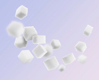 Image of Refined sugar cubes in air on color background