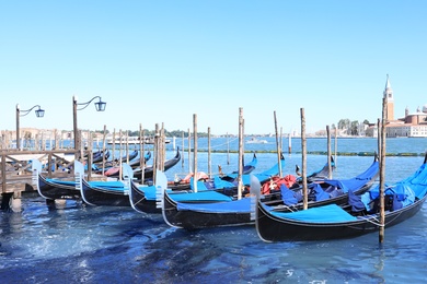 VENICE, ITALY - JUNE 13, 2019: Different gondolas at pier
