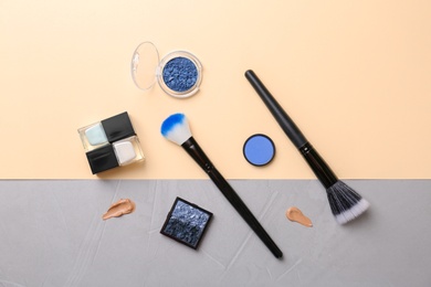 Photo of Flat lay composition with cosmetic products on color background