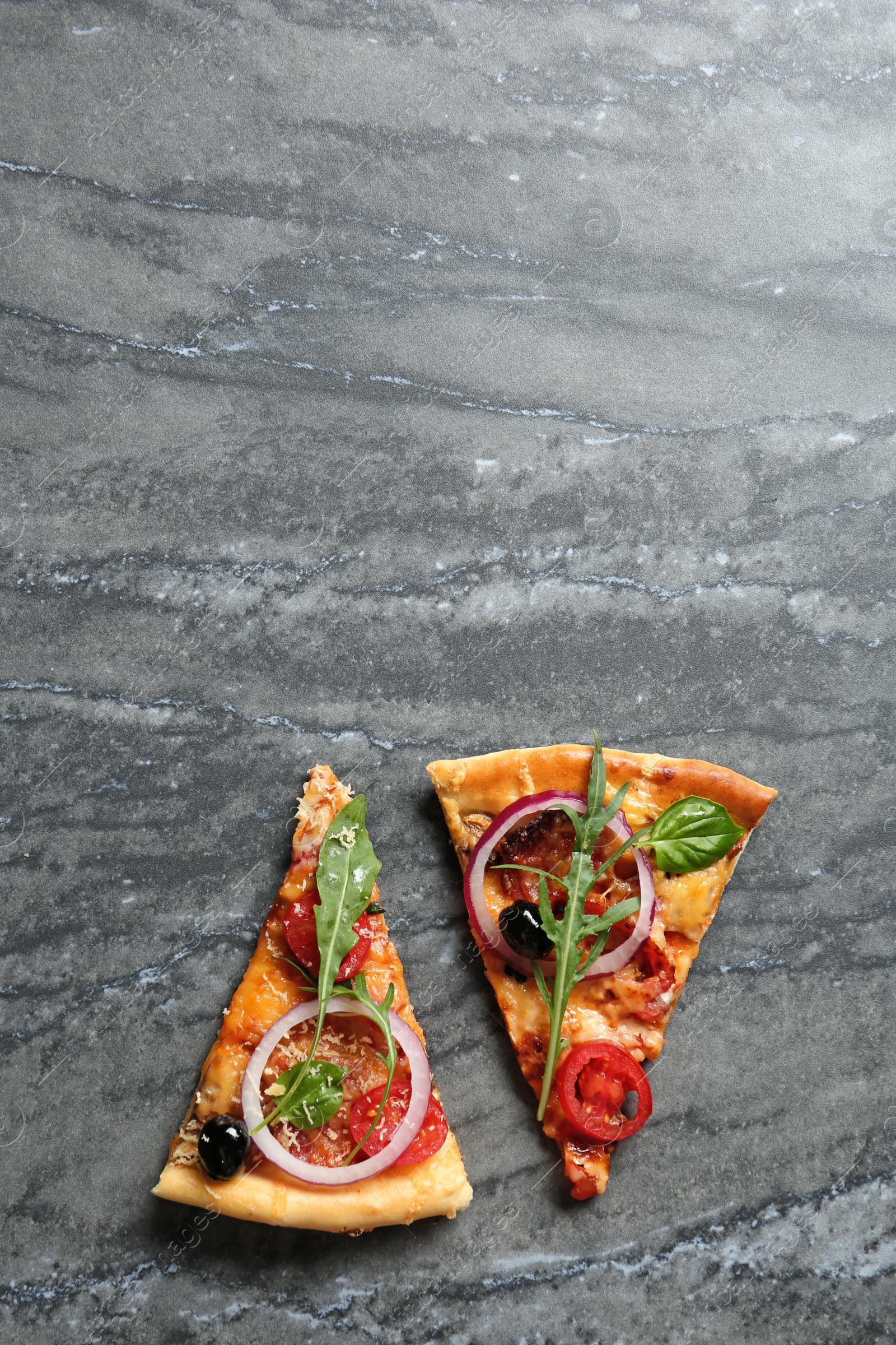 Photo of Flat lay composition with slices of tasty homemade pizza and space for text on table