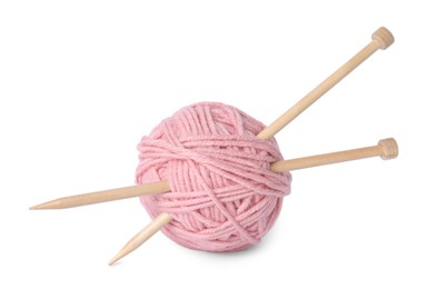 Photo of Soft pink woolen yarn and knitting needles on white background