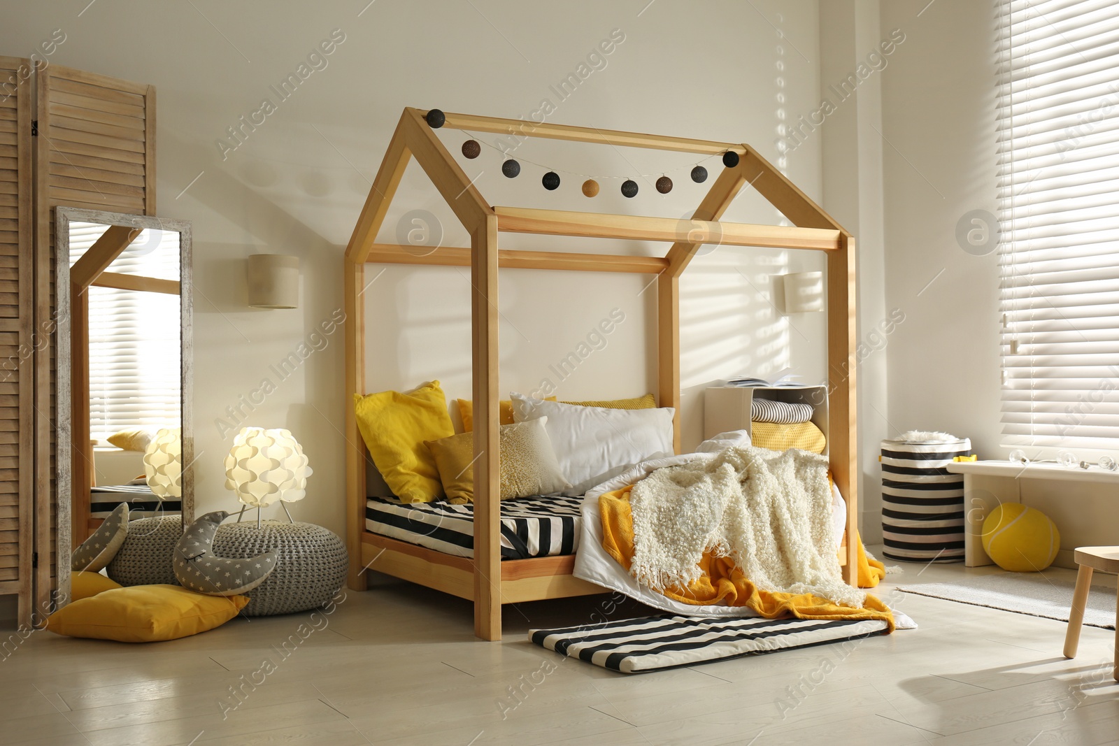 Photo of Cozy child room interior with comfortable bed