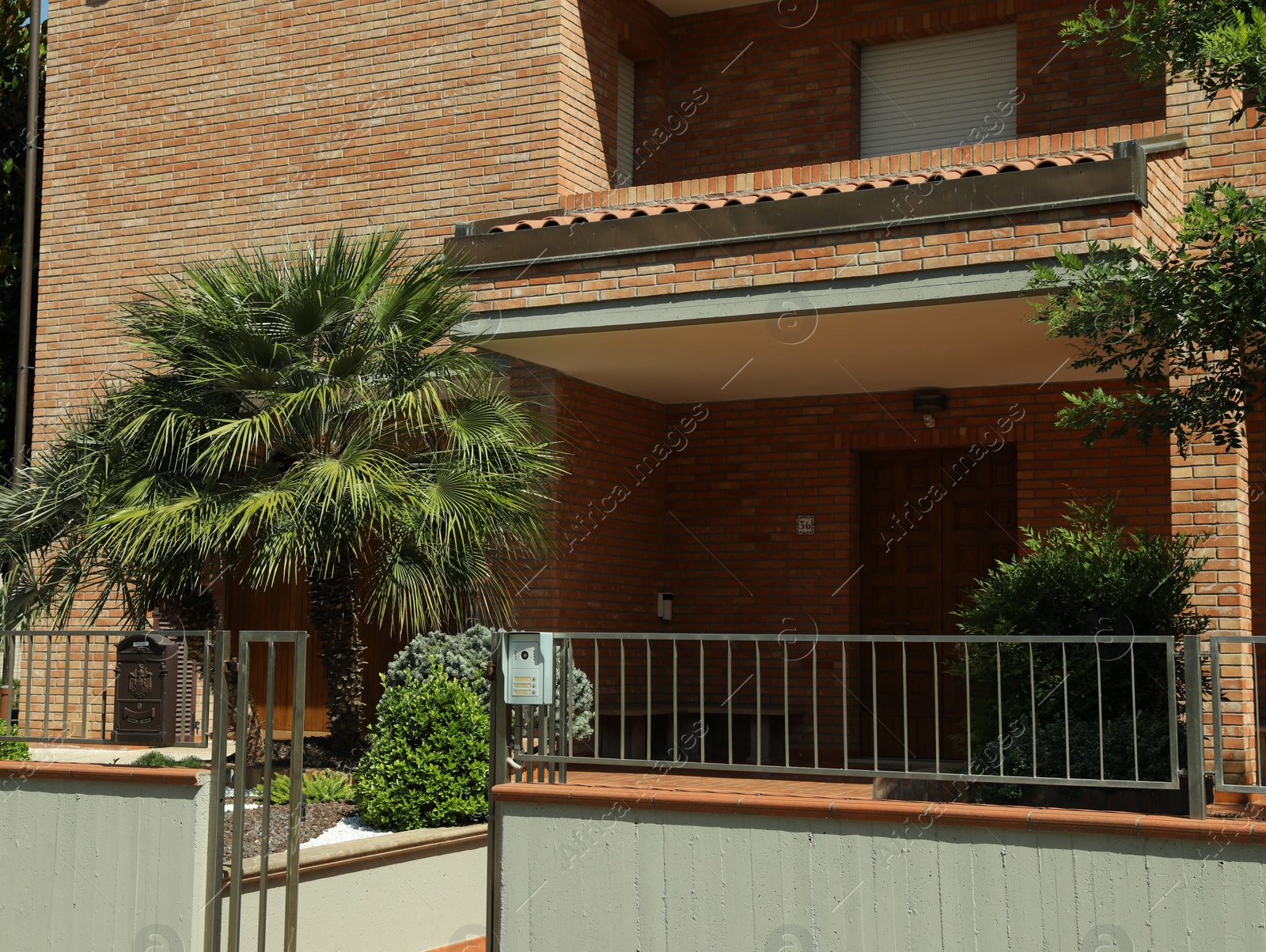 Photo of Beautiful residential house with yard on sunny day