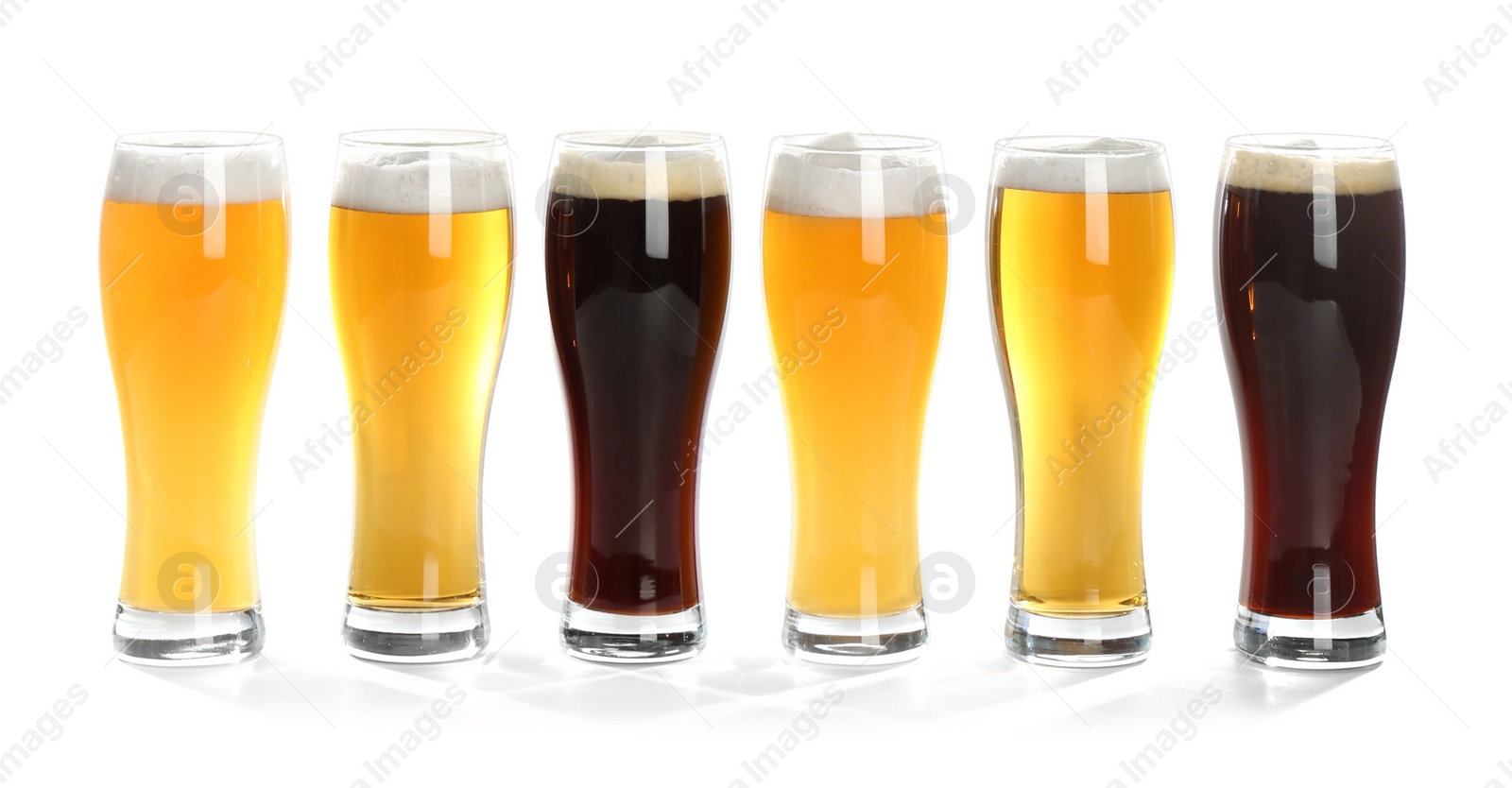 Photo of Glasses with different beer on white background