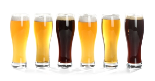 Photo of Glasses with different beer on white background