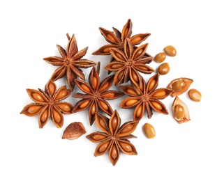 Photo of Dry anise stars with seeds on white background, top view