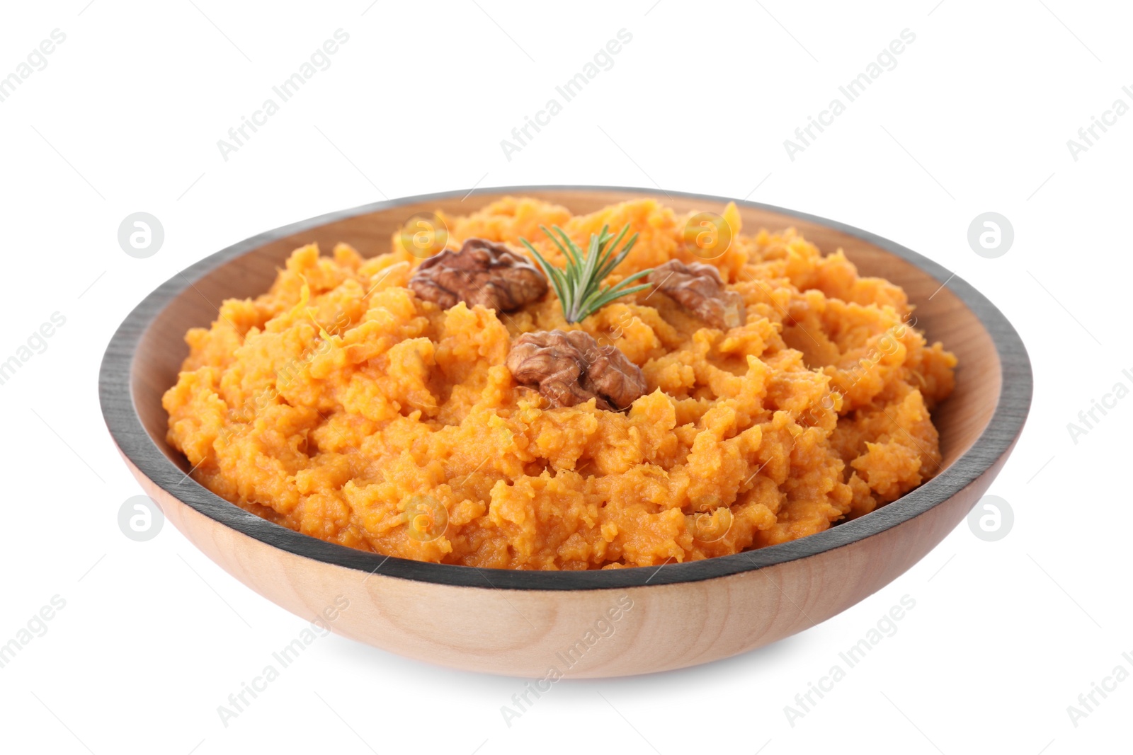 Photo of Bowl with mashed sweet potatoes on white background