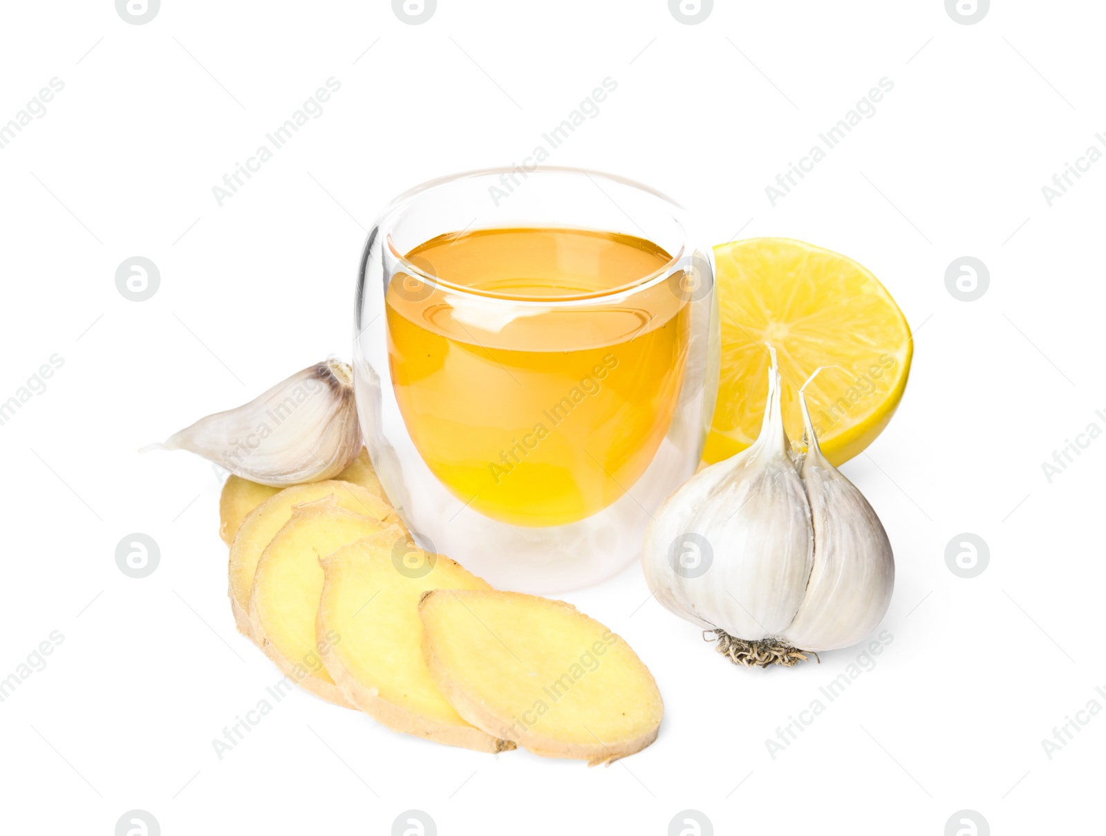 Photo of Fresh garlic and other natural cold remedies isolated on white